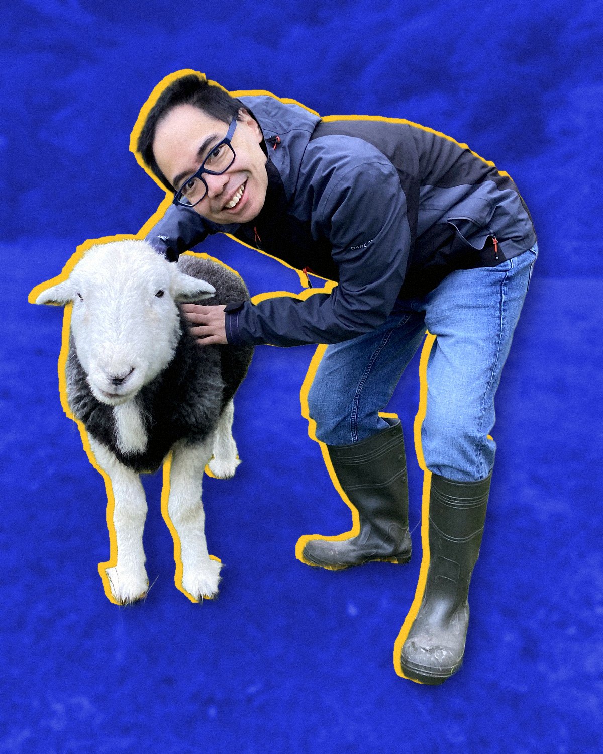 Kevin Cheung smiling beside a sheep in the hills